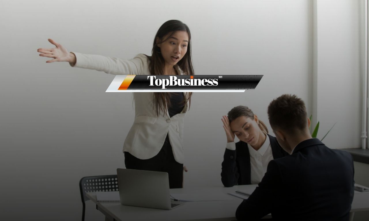 Photo of a lady yelling at her colleague, representing a toxic workplace environment