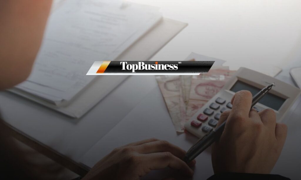 Photo of a man calculating his salary, representing overtime pay