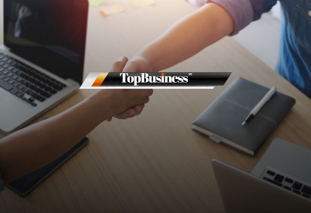 Photo of two people shaking hands, representing employee onboarding