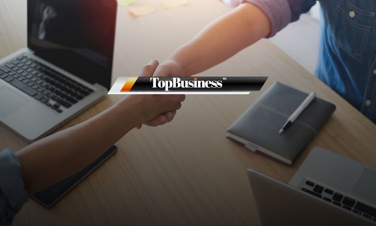 Photo of two people shaking hands, representing employee onboarding