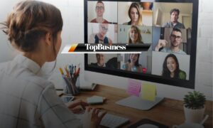Photo of colleagues using AI project management tools and holding a virtual meeting